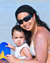 baby and mom with sunblock