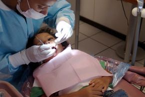 That first trip to the dentist can be scary. But explaining what's going to happen can help relieve anxiety for some kids.