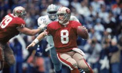 San Francisco quarterback Steve Young tries to avoid a Cowboys sack in the 1993 NFC Championship Game.