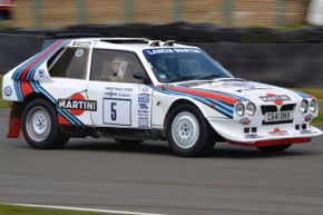 The Lancia Delta S4 is on a racetrack.
