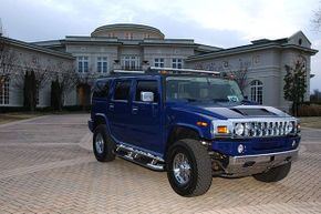 A custom-made Humvee sits outside Evander Holyfield's former 109-room mansion in Georgia.
