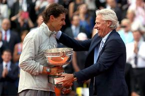 Bjorn Borg (R) presents the winning trophy at the 2014 French Open to Rafael Nadal. Now out of bankruptcy, Borg has a successful clothing line.