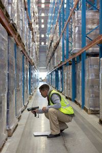 warehouse worker scans pallets