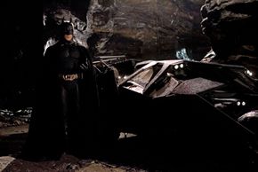 Batman and his ride in "Batman Begins"”border=