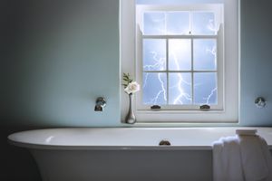 Lightning strike outside of bathroom window