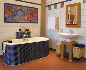 This easy-to-clean bathroom is tiled from floor to ceiling, including a unique tiled tub and decorative tile mural.See more pictures of bathroom decorating.