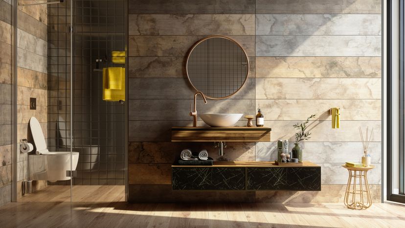 Luxury Bathroom Interior With Shower, Toilet, Mirror And Yellow Towels.