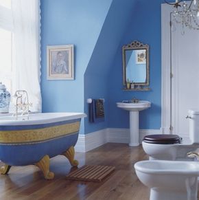 The ornately embellished tub gleams in this otherwise low-key bathroom.