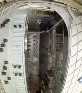 A wide-angle view of the Orbital Workshop waste management compartment. The actual toilet's down the hall, to your right. See more astronaut pictures.