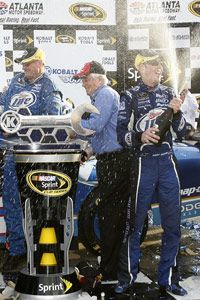 Driver Kurt Busch celebrates after winning the NASCAR Kobalt Tools 500 race at the Atlanta Motor Speedway in March 2009.  