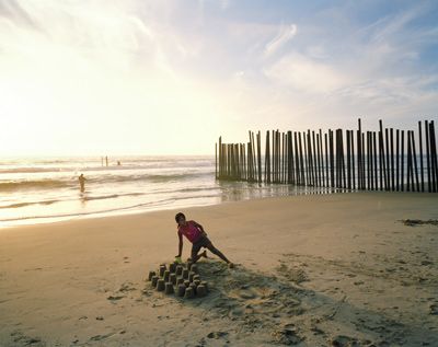 Border fence ending at Pacific Ocean at Imperial Beach, California) and Playa Tijuana, Tijuana, Baja, Mexico