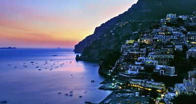 Buildings lit up at night on the Amalfi Coast in Italy