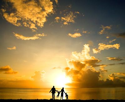 Silhouette of family on beach in Phuket, Thailand