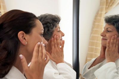 women applying moisturizer
