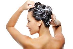 woman shampooing hair