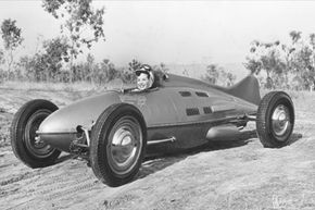 Woman driving Belly Tank Racer