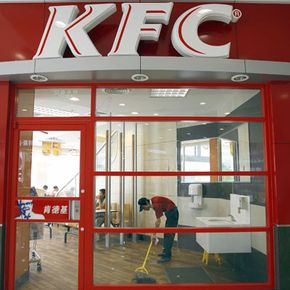 As fast food has spread across the world, so have fast-food jobs. A worker finishes his shift at a KFC in Chengdu, China.