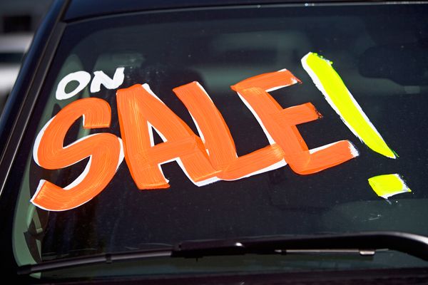 Sale decal on car windshield