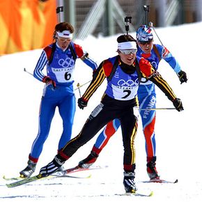 Female biathletes skiing freestyle in the 2002 Winter Olympics