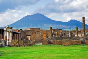 Vesuvius looms over Pompeii, the city that has enthralled archaeologists since the 16th century.