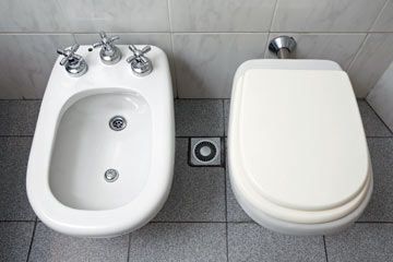 woman cleaning bathtub