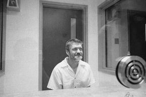Ted Kaczynski sits and smiles during an interview in a visiting room at the Federal ADX Supermax prison in Florence, Colo., 1999.