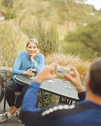 Couple enjoying wine on bike tour.