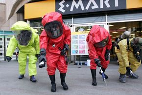 Emergency services in chemical protection clothing participate in an anti-chemical and biochemical terror exercise on May 21, 2007 in Seoul, South Korea.