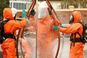 Emergency crews are decontaminated as police in the Australian state of Victoria conduct a chemical, biological, radiological (CBR) hostage exercise at Caulfield Racecourse in Melbourne, Australia.