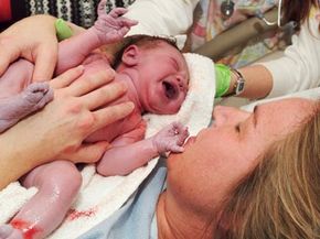 newborn baby with mother