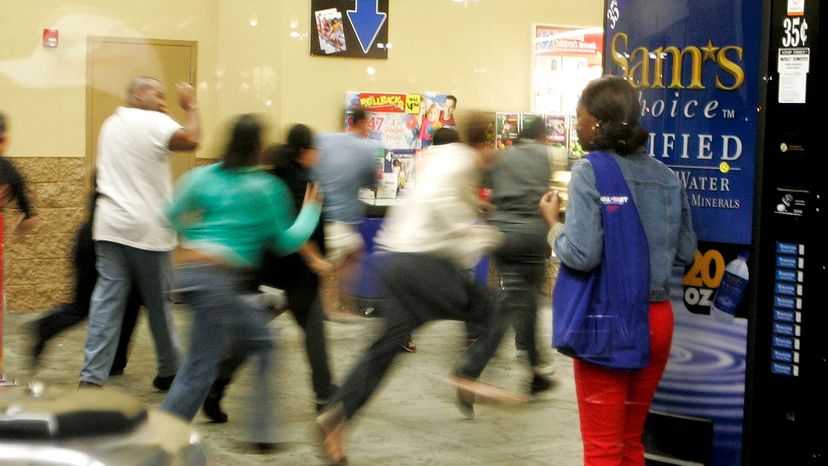 Shoppers sprint through the doors of a Miami Wal-Mart 