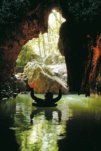 A tuber floating near the entrance at Waitomo. It's best to find out what the entire tour entails before you sign up.