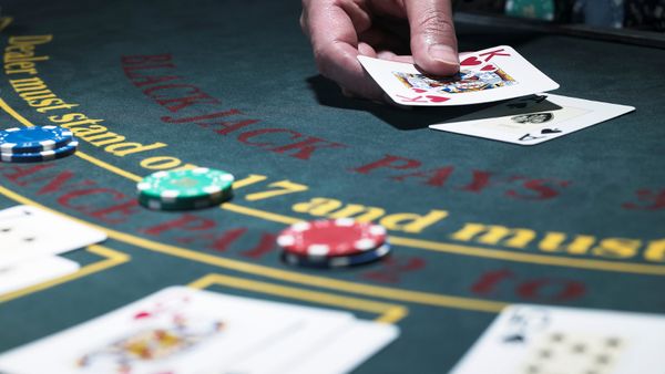 Dealer Playing Blackjack at a Casino Table