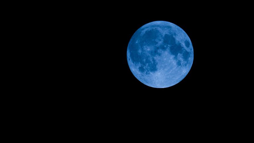 blue moon on a black sky