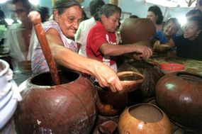 Local women distribute tiste, a drink made from rice and cocoa, in Nicoya, Costa Rica.