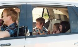 Family in car on road trip