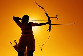 Jason Meyer shoots an arrow, which is attached to the bow with a heavy line  and a reel while bowfishing May 16, 2004, on Tainter Lake near Menomonie,  Wis. Meyer, of rural