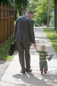 dad in business suit with son