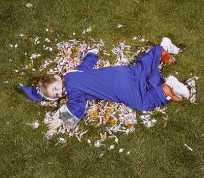 Boy in Costume Lying on Candy
