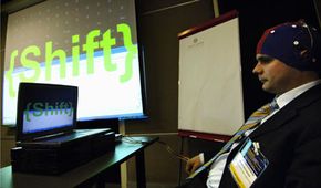 Dr. Peter Brunner demonstrates the brain-computer interface at a conference in Paris.