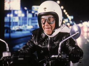 Not that kind of God Helmet. George Burns in the film &quot;Oh, God! Book II&quot;