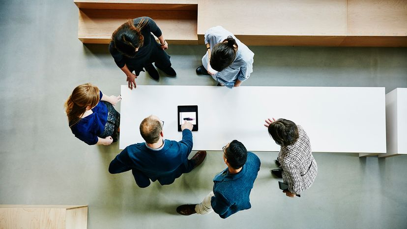 Birdseye view of business people working together at a table