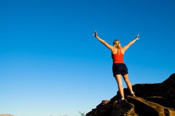 Person embracing healthy outdoor lifestyle.