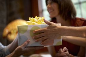 Two people exchange a gift.