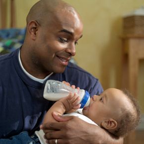 Father feeding baby