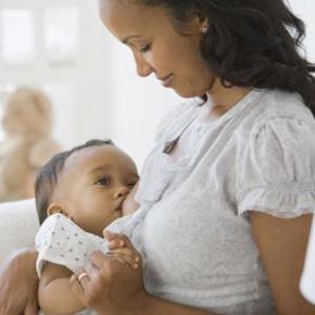 mother holding baby girl