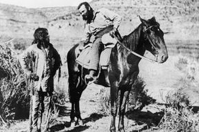 American anthropologist, geologist and explorer Major John Wesley Powell speaks with a Paiute Indian about the location of a water supply during a survey of Arizona in 1873.