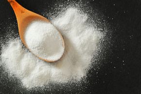 Baking soda's abrasive quality helps it scrub stains from your teeth.