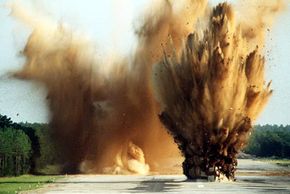 Soldiers set off two C-4 charges on an air base runway during a training operation. Like other high explosives, C-4's destructive power comes from rapidly expanding hot gas.