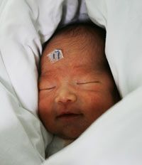 Babies born by C-section, like this quadruplet in China, can be at risk for complications.